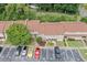 Aerial view of townhouse exterior with well-kept landscaping, convenient parking, and easy access to units at 1810 Ashborough Se Rd # G, Marietta, GA 30067