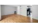 View of the living room showing hardwood floors and a glimpse into the kitchen at 1810 Ashborough Se Rd # G, Marietta, GA 30067