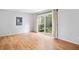 Bright living room with wood floors and sliding glass door access to private patio at 1810 Ashborough Se Rd # G, Marietta, GA 30067