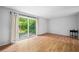 Bright living room with hardwood floors and sliding glass doors to the backyard at 1810 Ashborough Se Rd # G, Marietta, GA 30067