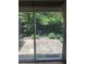 Outdoor patio with privacy fence and lush greenery viewed through sliding glass doors at 1810 Ashborough Se Rd # G, Marietta, GA 30067
