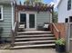 Inviting back deck with pergola, seating, and door to the house at 2002 Shalimar Ne Dr, Atlanta, GA 30345