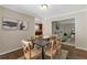Inviting dining room with hardwood floors and an open view to the living room at 2002 Shalimar Ne Dr, Chamblee, GA 30345