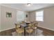 Inviting dining room featuring hardwood floors and a modern table, perfect for Gathering meals at 2002 Shalimar Ne Dr, Chamblee, GA 30345