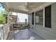 Relaxing front porch with a swing, ceiling fan, and great natural light, ideal for outdoor enjoyment at 2002 Shalimar Ne Dr, Chamblee, GA 30345