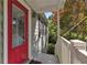 Exterior view of front porch with red door and painted railing at 2002 Shalimar Ne Dr, Chamblee, GA 30345