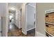 Hallway featuring hardwood floors, neutral paint, closet space, and access to a bedroom at 2002 Shalimar Ne Dr, Chamblee, GA 30345