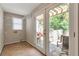 Bright laundry area featuring tile floors and access to a charming outdoor patio and backyard at 2002 Shalimar Ne Dr, Chamblee, GA 30345