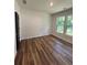 Bedroom with beautiful wood-look flooring and natural light from the double window at 2588 Abner Nw Pl, Atlanta, GA 30318