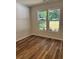 Bedroom with wood-look flooring and bright natural light at 2588 Abner Nw Pl, Atlanta, GA 30318