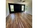 Bedroom with hardwood floors, a ceiling fan, and a feature wall with two windows at 2588 Abner Nw Pl, Atlanta, GA 30318