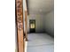 Covered entryway with concrete floor and visible house number offers a modern and inviting welcome at 2588 Abner Nw Pl, Atlanta, GA 30318