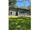 Modern single-story home featuring large windows, horizontal siding, and a well-maintained lawn at 2588 Abner Nw Pl, Atlanta, GA 30318