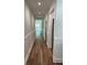 Bright hallway with hardwood floors, white trim, and paneled wainscoting leading to various rooms at 2588 Abner Nw Pl, Atlanta, GA 30318