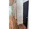 Hallway featuring wood-look flooring and white molding at 2588 Abner Nw Pl, Atlanta, GA 30318