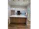 Kitchen with white cabinets, white countertops, stainless steel appliances, and an island at 2588 Abner Nw Pl, Atlanta, GA 30318