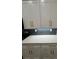 Close-up of the kitchen featuring shaker cabinets, subway tile backsplash, and quartz countertops at 2588 Abner Nw Pl, Atlanta, GA 30318