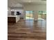 Spacious open floor plan with hardwood floors, a modern kitchen, and sliding glass doors at 2588 Abner Nw Pl, Atlanta, GA 30318