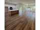 Open-concept living area with wood-look flooring, and bright natural light at 2588 Abner Nw Pl, Atlanta, GA 30318