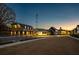 Scenic street view of neighborhood buildings at dusk, with sidewalks and a well-manicured lawn at 50 Black Gum Lot 49 Ln, Auburn, GA 30011