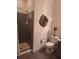 Cozy bathroom features a toilet, shower with glass doors and vanity at 522 Blue Mountain, Canton, GA 30114