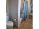 Bathroom with toilet, shower and tiled floor at 522 Blue Mountain, Canton, GA 30114