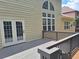 Back deck area featuring well-maintained railings, French doors, and a private backyard at 522 Blue Mountain, Canton, GA 30114