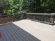 Spacious deck with painted railings and a serene wooded backdrop at 522 Blue Mountain, Canton, GA 30114