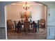 Formal dining room boasts a chandelier and room for six at the table at 522 Blue Mountain, Canton, GA 30114