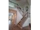 Grand foyer with high ceilings, hardwood floors, and a staircase leading to the upper level at 522 Blue Mountain, Canton, GA 30114
