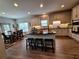 Gorgeous kitchen featuring granite counters, large center island, stainless steel appliances and bar stool seating at 522 Blue Mountain, Canton, GA 30114
