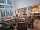 Bright living room featuring tall windows, hardwood floors, and comfortable seating at 522 Blue Mountain, Canton, GA 30114