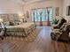 Comfortable main bedroom showcasing a tray ceiling and large windows at 522 Blue Mountain, Canton, GA 30114