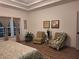 Relaxing main bedroom featuring neutral tones and a cozy seating area at 522 Blue Mountain, Canton, GA 30114