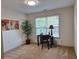 Bright office space featuring a window view, modern decor, and neutral carpet at 522 Blue Mountain, Canton, GA 30114