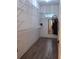 Organized walk-in closet with custom shelving and hardwood floors at 522 Blue Mountain, Canton, GA 30114