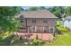 Spacious backyard featuring a brick patio, manicured lawn, and lush landscaping at 1219 Hadaway Ct, Lawrenceville, GA 30043