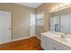 Bright bathroom with white vanity and hardwood floors, offering a clean and functional space at 1219 Hadaway Ct, Lawrenceville, GA 30043