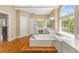 Bathroom featuring a large tub under a big arched window and spacious vanity at 1219 Hadaway Ct, Lawrenceville, GA 30043
