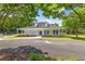 Community center with a covered porch and manicured landscaping, offering a welcoming space for residents at 1219 Hadaway Ct, Lawrenceville, GA 30043