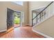 Inviting foyer showcasing gleaming hardwood floors and staircase to the second floor at 1219 Hadaway Ct, Lawrenceville, GA 30043