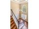 Grand foyer with high ceilings, staircase, chandelier, and arched window, creating an elegant entryway at 1219 Hadaway Ct, Lawrenceville, GA 30043