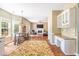 Open concept kitchen with granite countertops, island seating, and view to the living room at 1219 Hadaway Ct, Lawrenceville, GA 30043