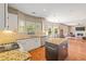Open concept kitchen with granite countertops, stainless steel appliances, and view to the living room at 1219 Hadaway Ct, Lawrenceville, GA 30043