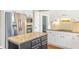 Kitchen featuring white cabinets, stainless steel appliances, granite countertops, and a center island at 1219 Hadaway Ct, Lawrenceville, GA 30043