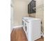 Well-equipped laundry room with modern washer and dryer units and ample storage space at 1219 Hadaway Ct, Lawrenceville, GA 30043
