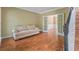 Cozy living room with wood floors and an opening to another room with french doors at 1219 Hadaway Ct, Lawrenceville, GA 30043