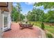 Inviting brick patio with outdoor seating, ideal for relaxing or dining al fresco at 1219 Hadaway Ct, Lawrenceville, GA 30043