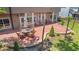 Charming brick patio with outdoor furniture, perfect for enjoying the serene backyard setting at 1219 Hadaway Ct, Lawrenceville, GA 30043
