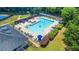 Large community pool with ample seating, lounge chairs, and shaded pergolas offers a resort-like experience at 1219 Hadaway Ct, Lawrenceville, GA 30043